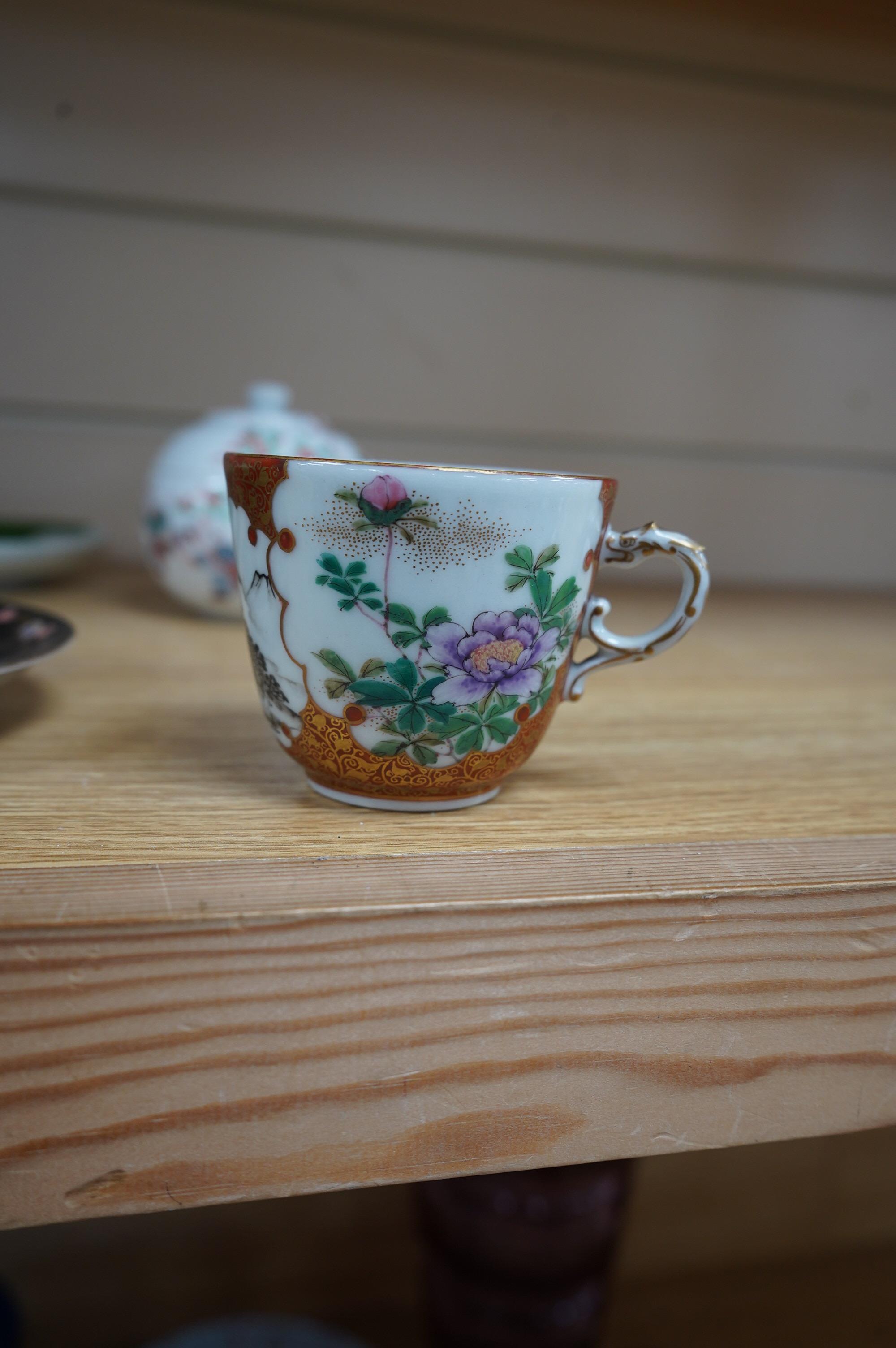 A group of Chinese and Japanese ceramics to include Yixing teapots, porcelain cups and saucers, a blue and white vase and a tiger talisman. Condition - mostly good